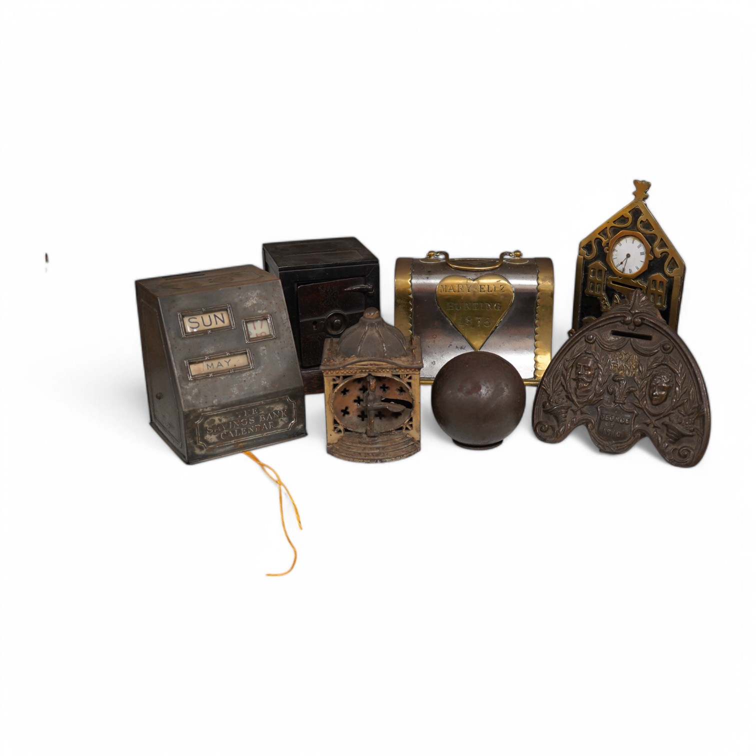 Six various metalware money boxes to include a ‘cannonball’ money box, a ‘safe’ money box, a George V ‘Royal Bank’ money box etc. 19th century and later. Condition - fair